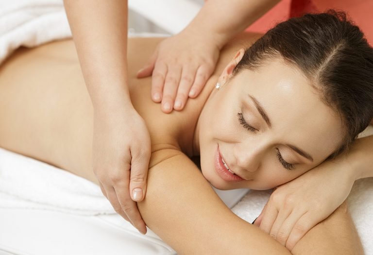 Woman enjoying a relaxing Full Body Massage Tysons Corner session at a spa, promoting stress relief and rejuvenation.