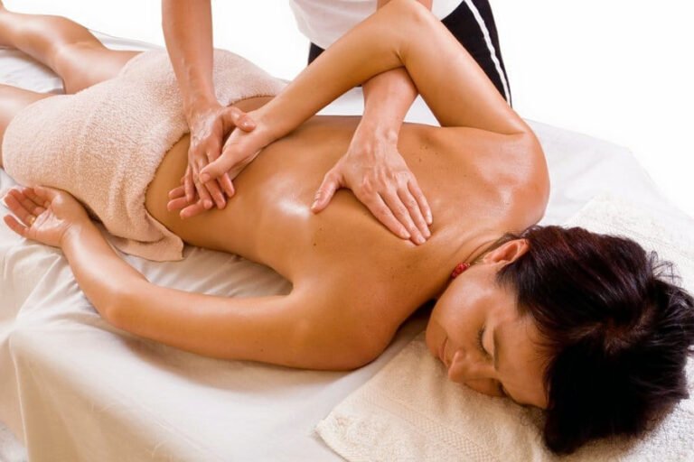 Therapist performing a relaxing back treatment during a Therapeutic Massage Chevy Chase session for muscle tension relief and full-body relaxation.